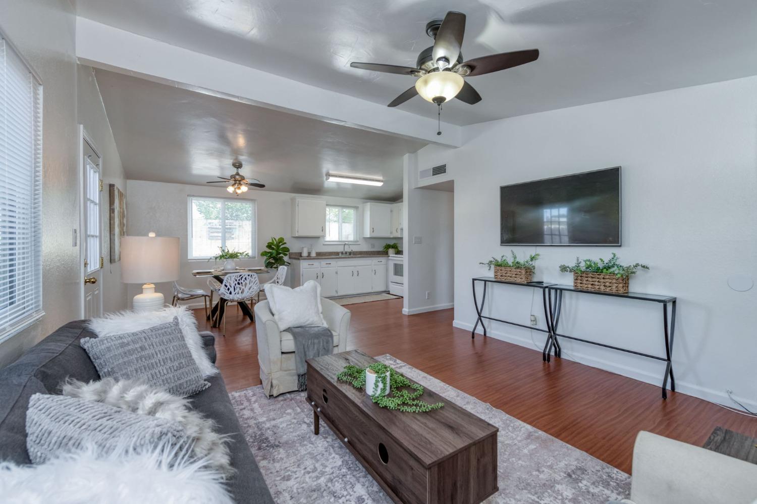 2607 Crescent Avenue Clovis, CA 93612 - Photo 9 of 26 a living room with furniture and a flat screen tv