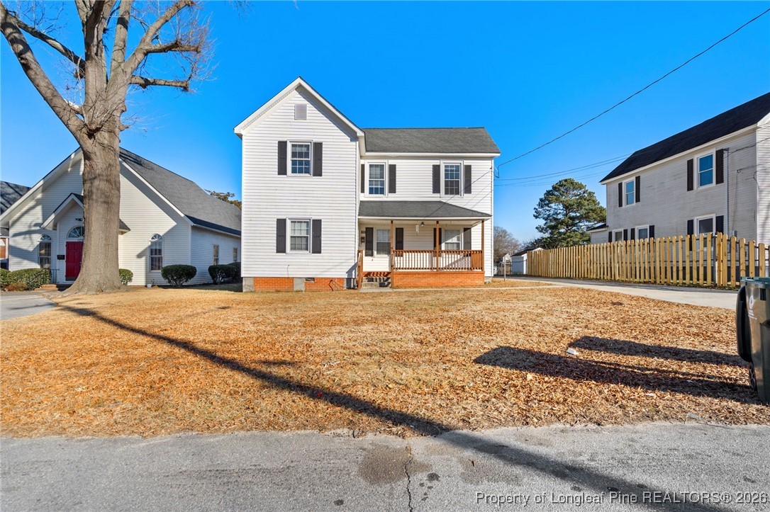 107 North 12th Street Erwin, NC 28339 - Photo 2 of 40 a front view of a house with a yard
