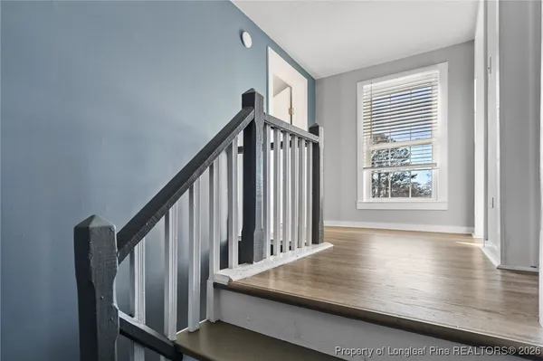 a view of entryway with wooden floor