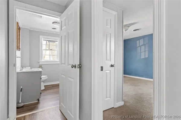 a view of a bathroom from the hallway