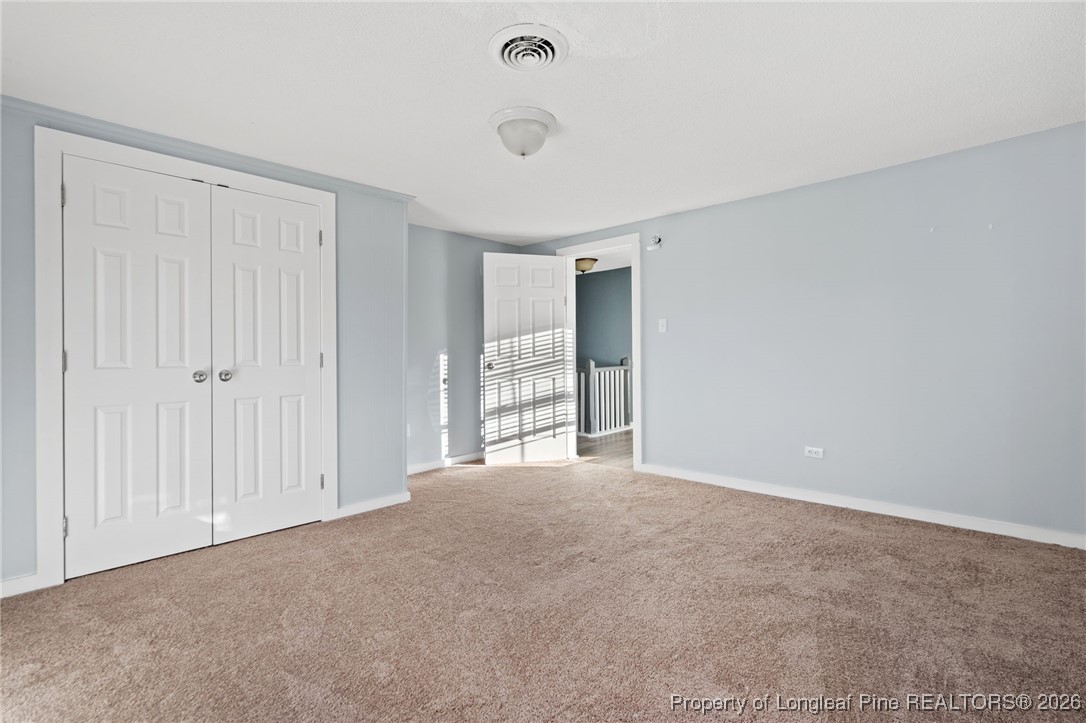 107 North 12th Street Erwin, NC 28339 - Photo 30 of 40 a view of an empty room with a window