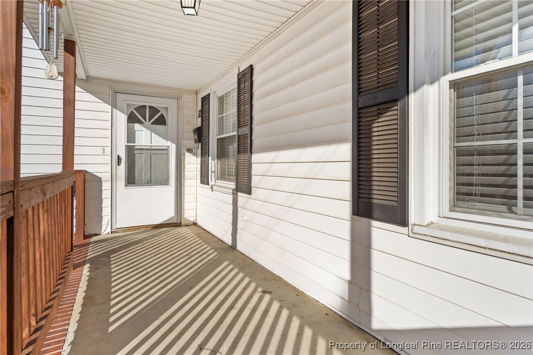 107 North 12th Street Erwin, NC 28339 - Photo 5 of 40 a view of a balcony with wooden floor and stairs