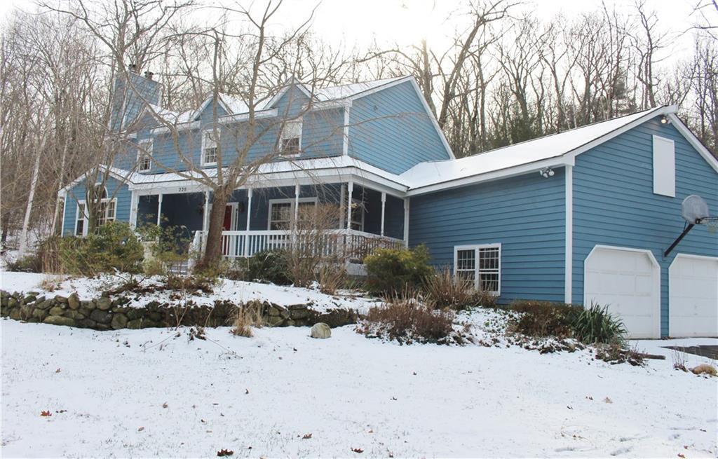 220 Wright Road Canton, CT 06019 - Photo 1 of 1 a front view of a house with a yard covered with snow
