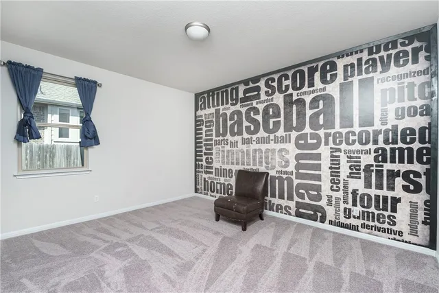 a view of an empty room with furniture and staircase