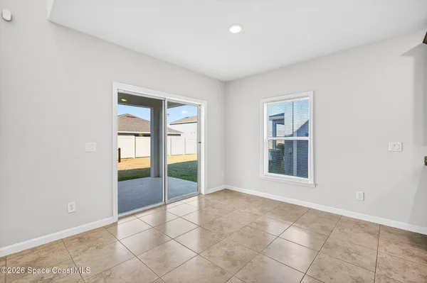 a view of an empty room and a window
