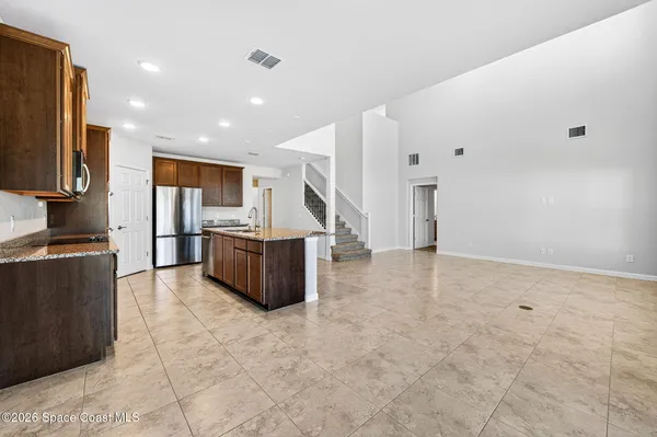 a bathroom with a double vanity sink toilet mirror and bathtub