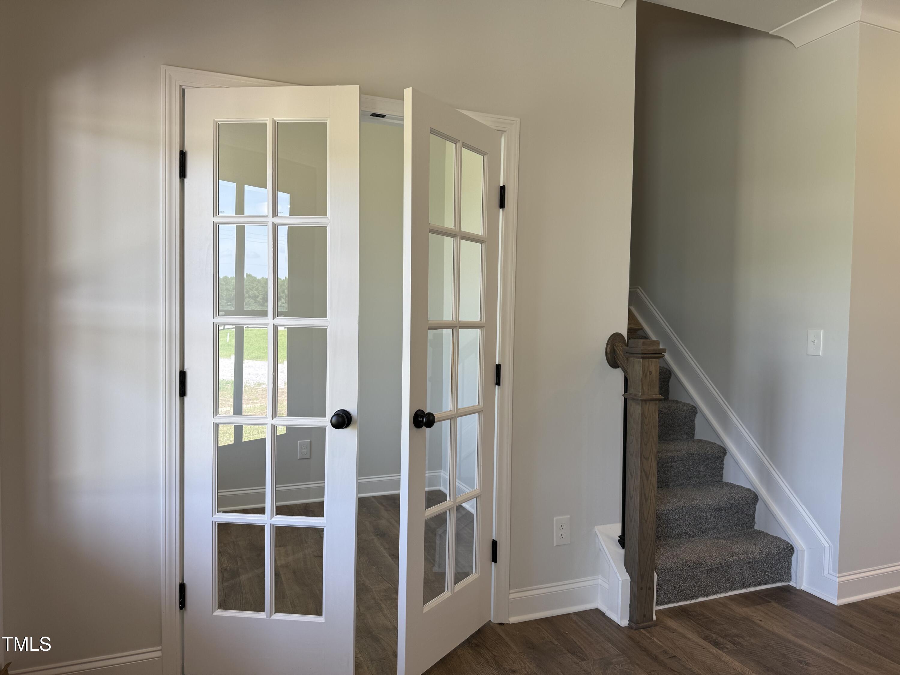 3943 Baileys Xrds Road Coats, NC 27521 - Photo 3 of 20 a view of staircase with white walls and windows