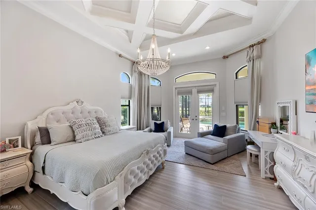 a bathroom with a bathtub and a hallway