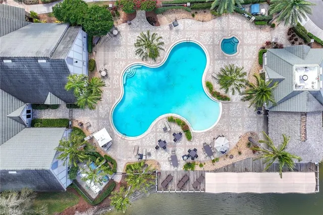 a view of a lake with boats and trees in the background