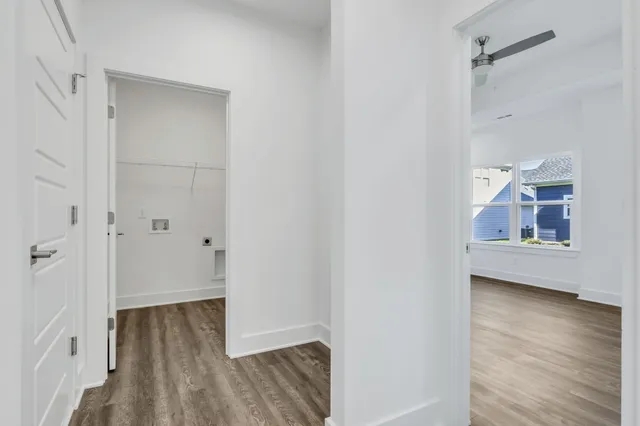 a view of room with wooden floor