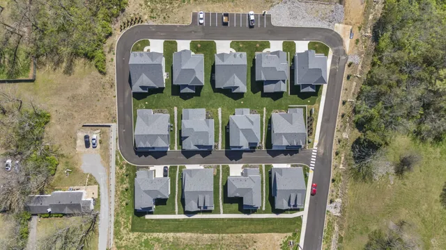 front view of a house with a sign broad