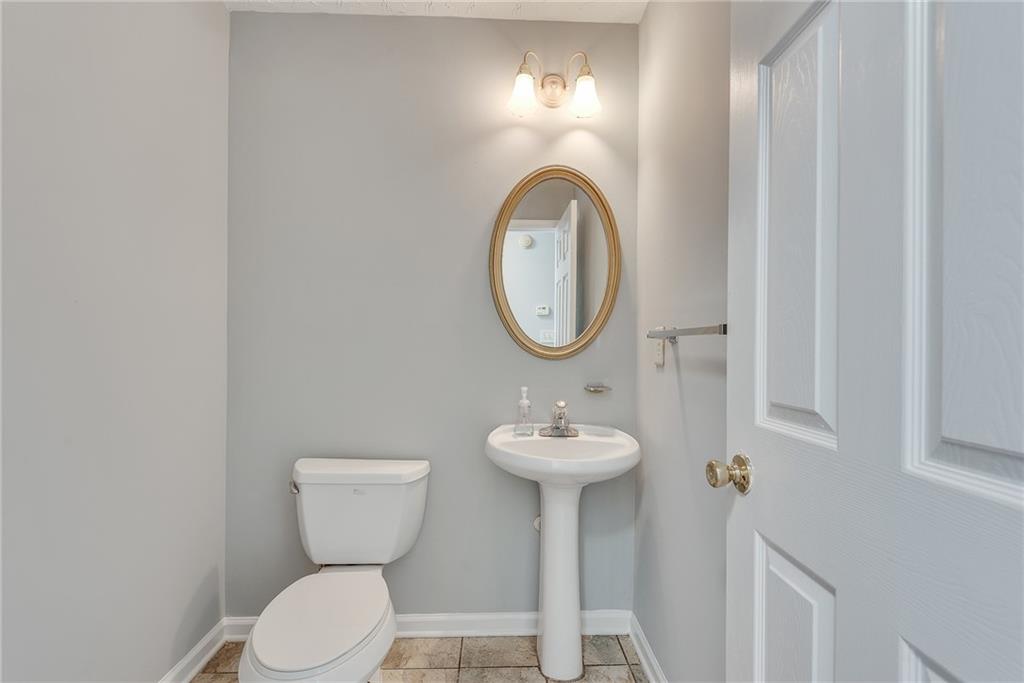 3337 Baymount Way Lawrenceville, GA 30043 - Photo 22 of 47 a bathroom with a sink mirror and toilet