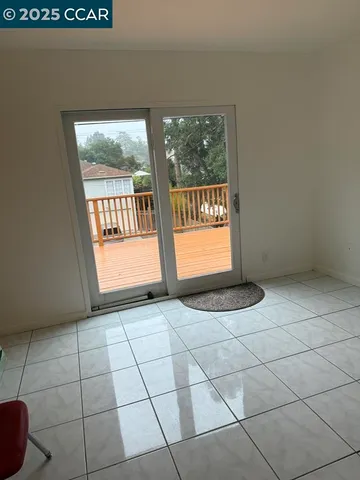 a view of an empty room and window