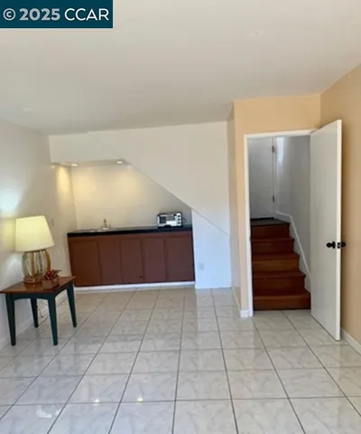 a view of a hallway with seating area