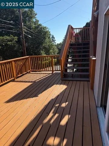 a view of balcony with wooden floor