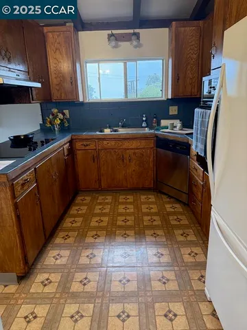 a kitchen with blue cabinets and a stove