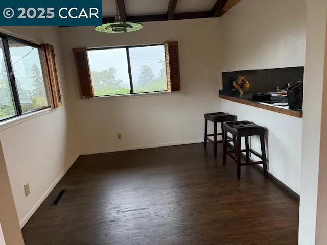 a view of kitchen with furniture and window
