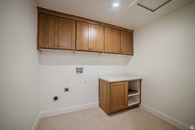 223 South Cottonwood Road, Unit 7501 Vineyard, UT 84059 - Photo 17 of 45 Dedicated utility space featuring ample wood-finish cabinetry, a white countertop, and recessed lighting