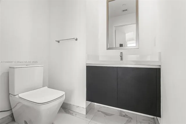 a view of a room with lots of gym equipment