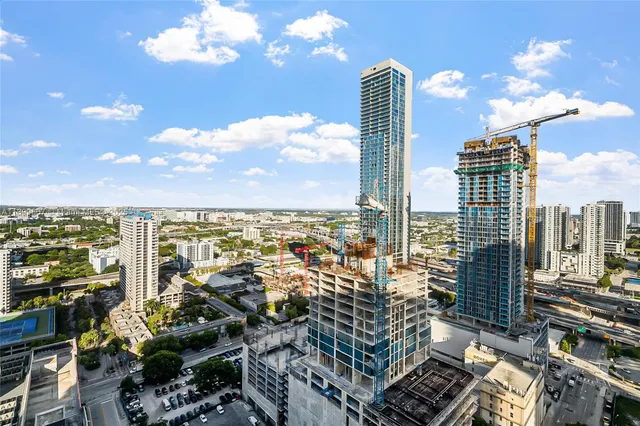 an open kitchen with dining table and chairs