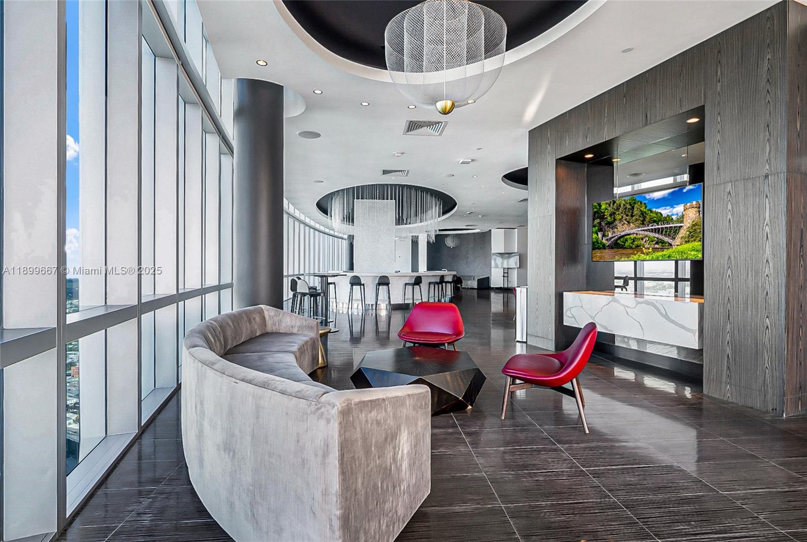 851 Northeast 1st Avenue, Unit 2802 Miami, FL 33132 - Photo 31 of 59 a living room with furniture and a floor to ceiling window