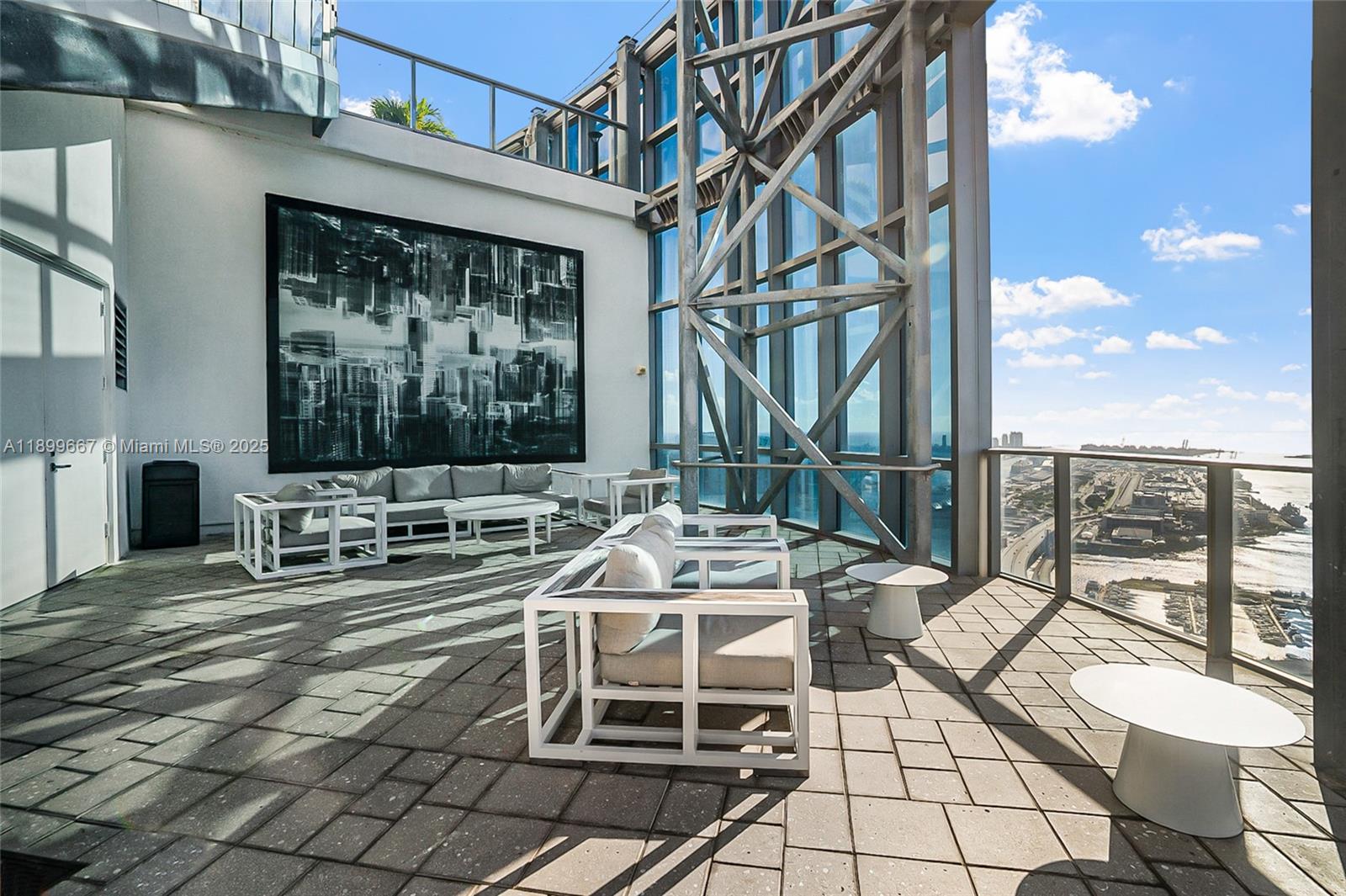 851 Northeast 1st Avenue, Unit 2802 Miami, FL 33132 - Photo 37 of 59 a view of balcony with chairs and iron fence
