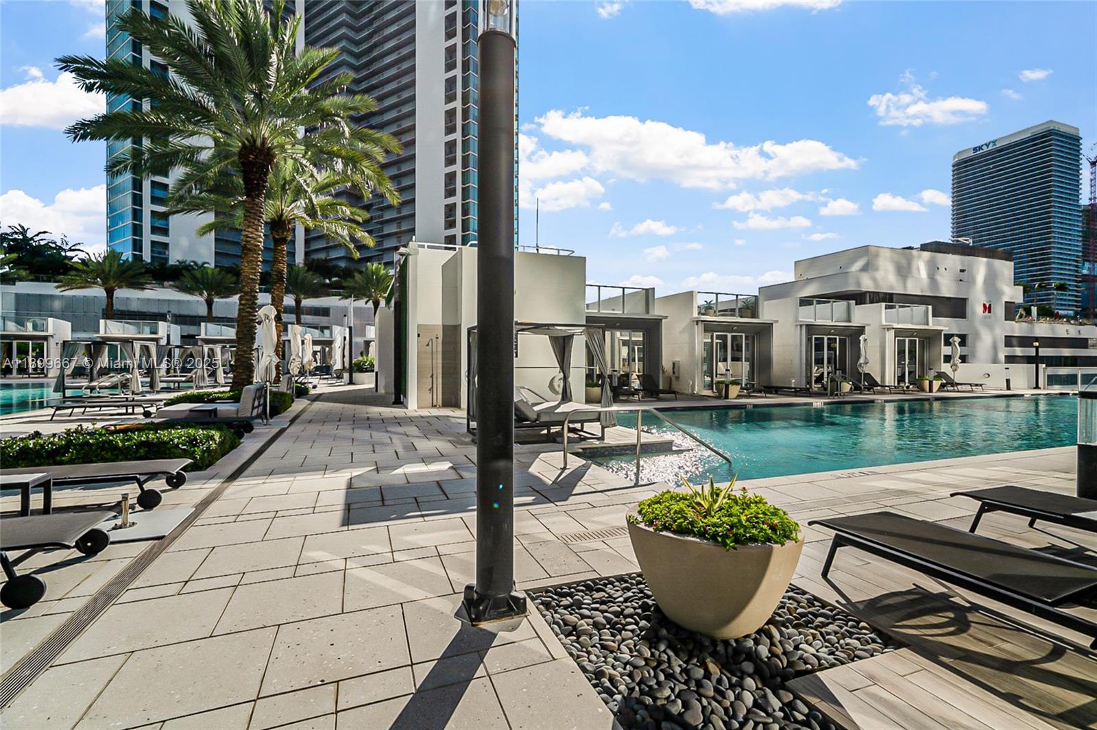 851 Northeast 1st Avenue, Unit 2802 Miami, FL 33132 - Photo 41 of 59 a view of a patio with couches chairs and a table