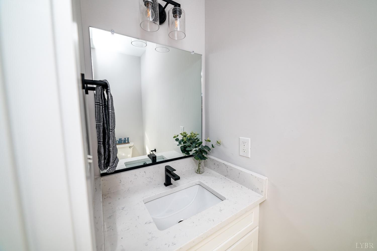 71 Allure Drive Rustburg, VA 24588 - Photo 19 of 56 a bathroom with a sink and a mirror