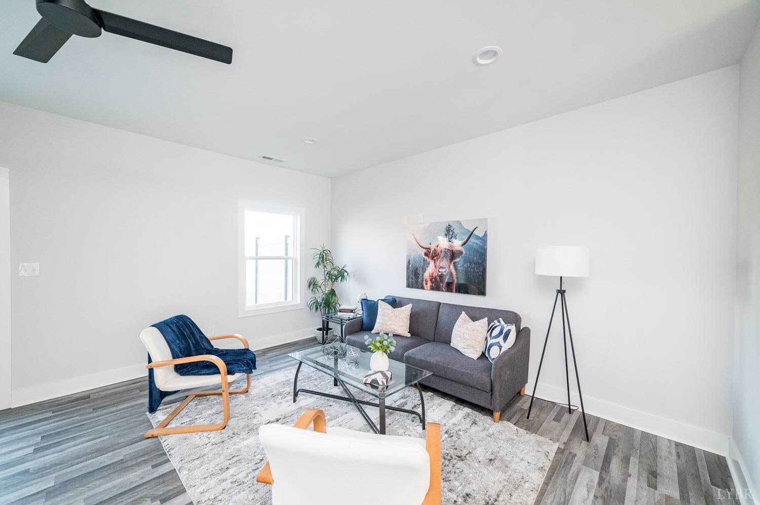 71 Allure Drive Rustburg, VA 24588 - Photo 22 of 56 a living room with furniture and wooden floor