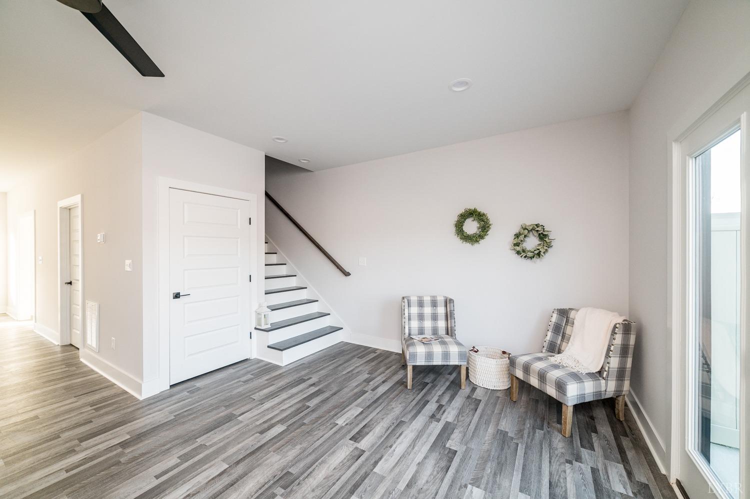 71 Allure Drive Rustburg, VA 24588 - Photo 26 of 56 a living room with furniture and a wooden floor