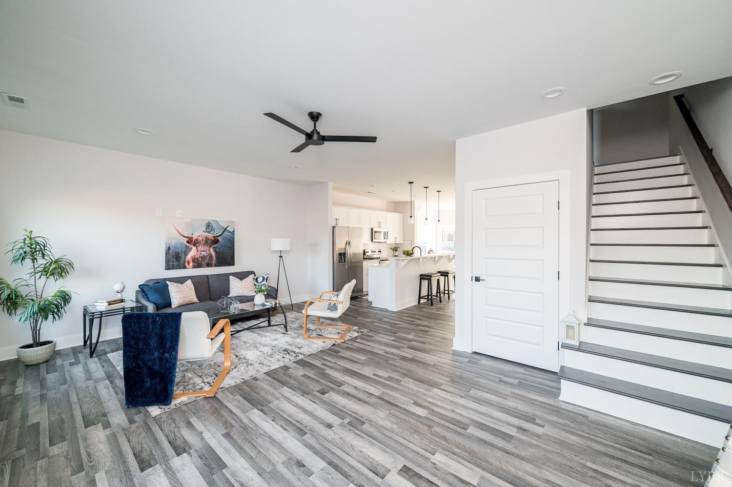 71 Allure Drive Rustburg, VA 24588 - Photo 30 of 56 a living room with furniture and a wooden floor