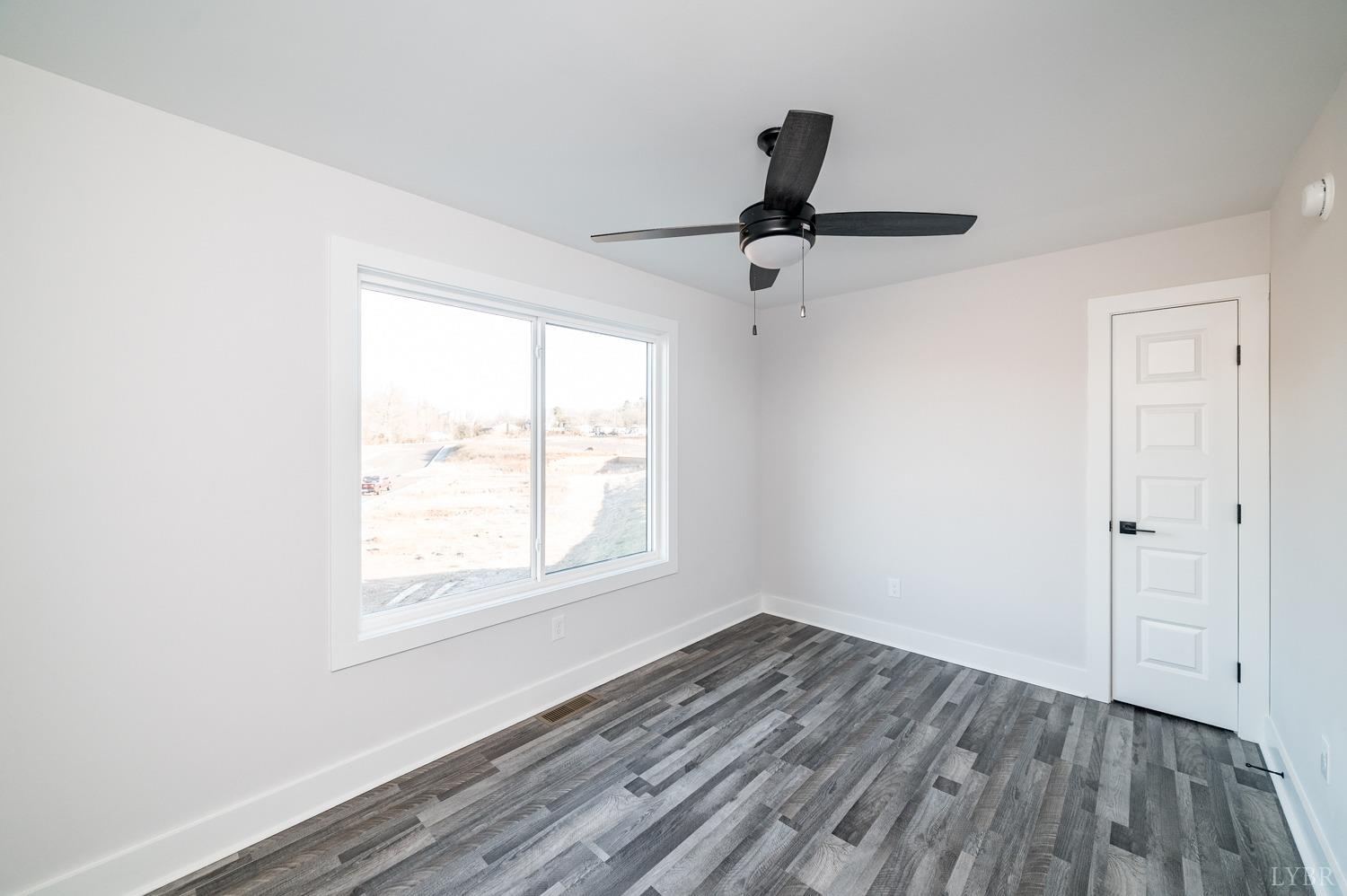 71 Allure Drive Rustburg, VA 24588 - Photo 33 of 56 wooden floor in an empty room with a window