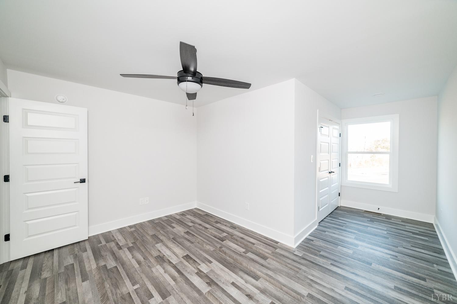 71 Allure Drive Rustburg, VA 24588 - Photo 37 of 56 wooden floor in an empty room with a window