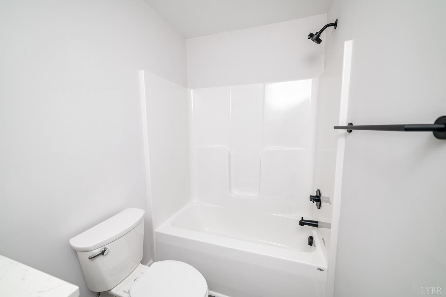 71 Allure Drive Rustburg, VA 24588 - Photo 40 of 56 a white toilet sitting next to a bath tub