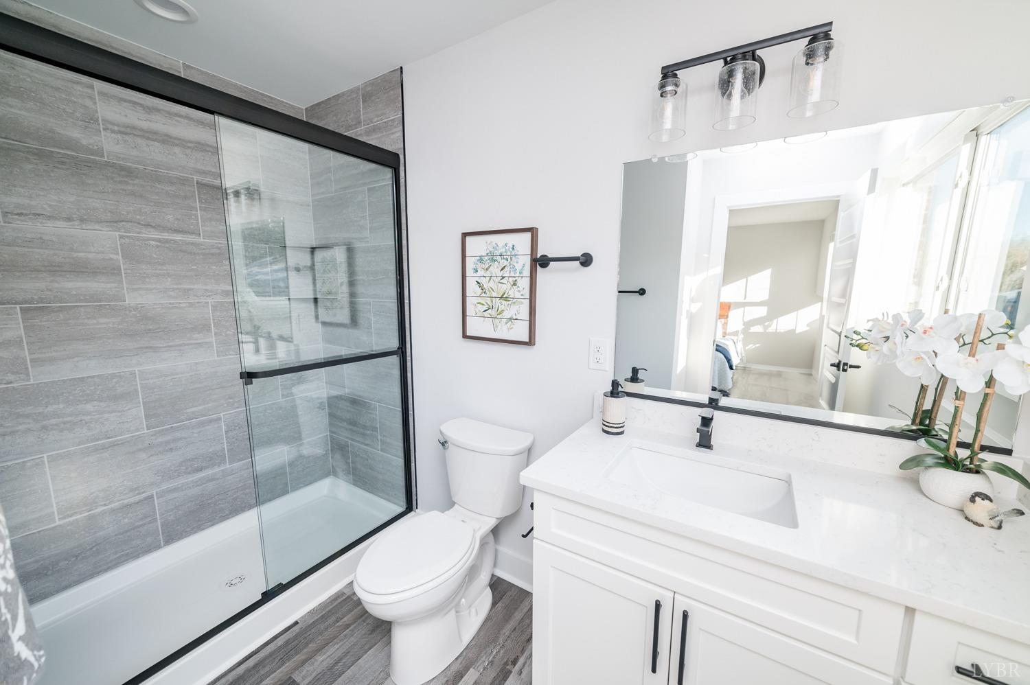 71 Allure Drive Rustburg, VA 24588 - Photo 43 of 56 a bathroom with a sink toilet and shower