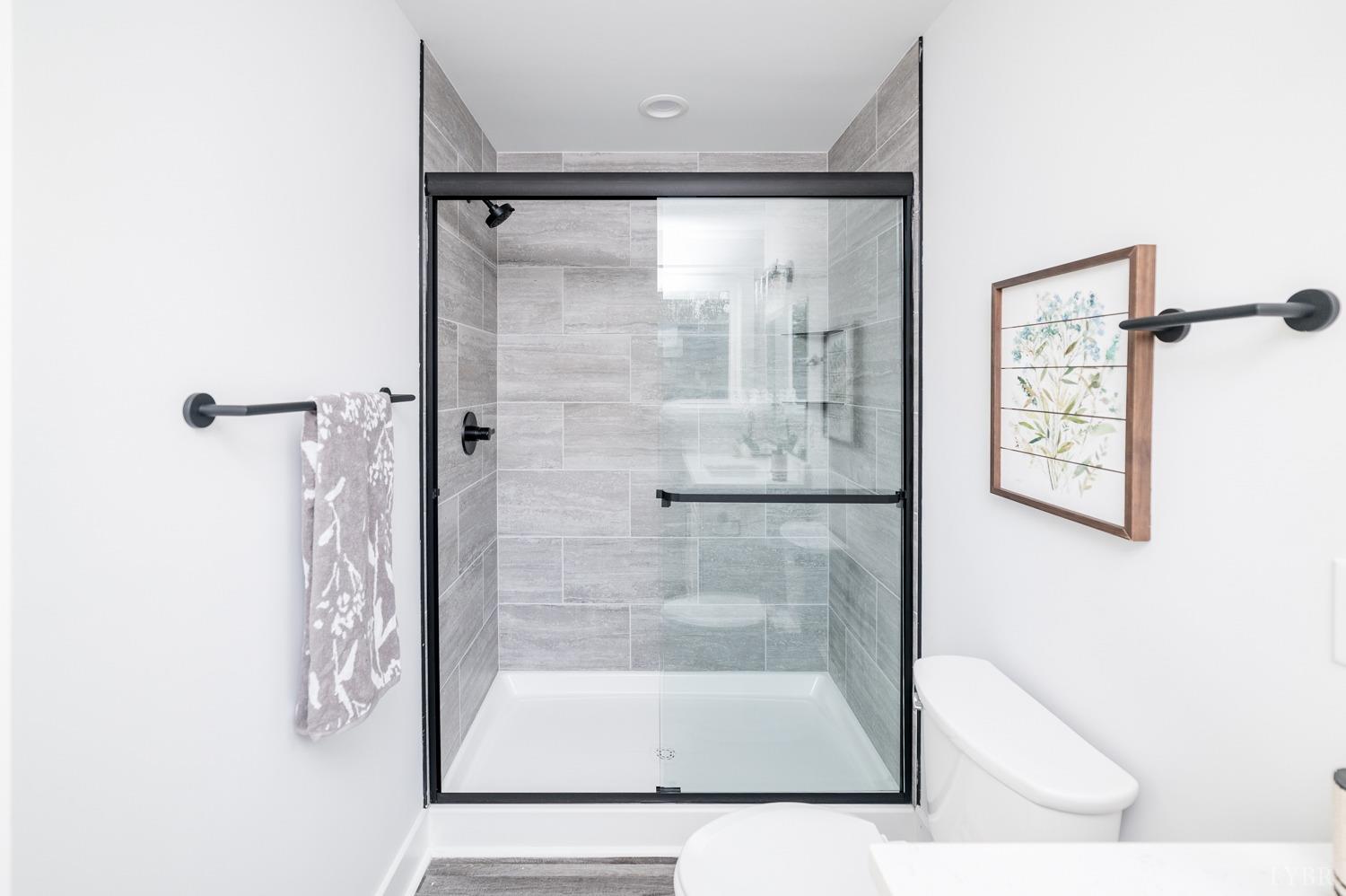 71 Allure Drive Rustburg, VA 24588 - Photo 44 of 56 a bathroom with a glass shower door