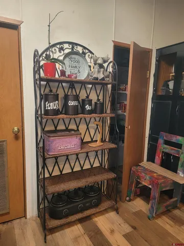 a view of staircase with wooden floor