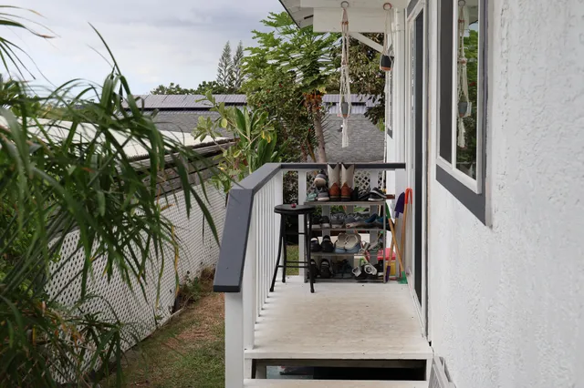 a kitchen with a sink and lots of wooden cabinets