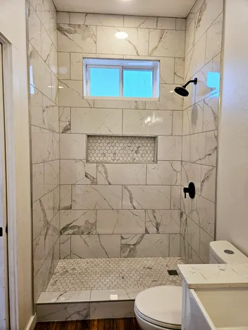 a view of yard with wooden fence and a large tree