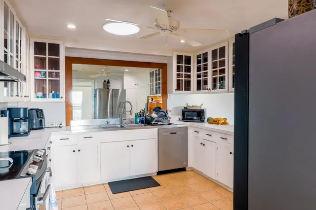 a view of a dining room with furniture and window