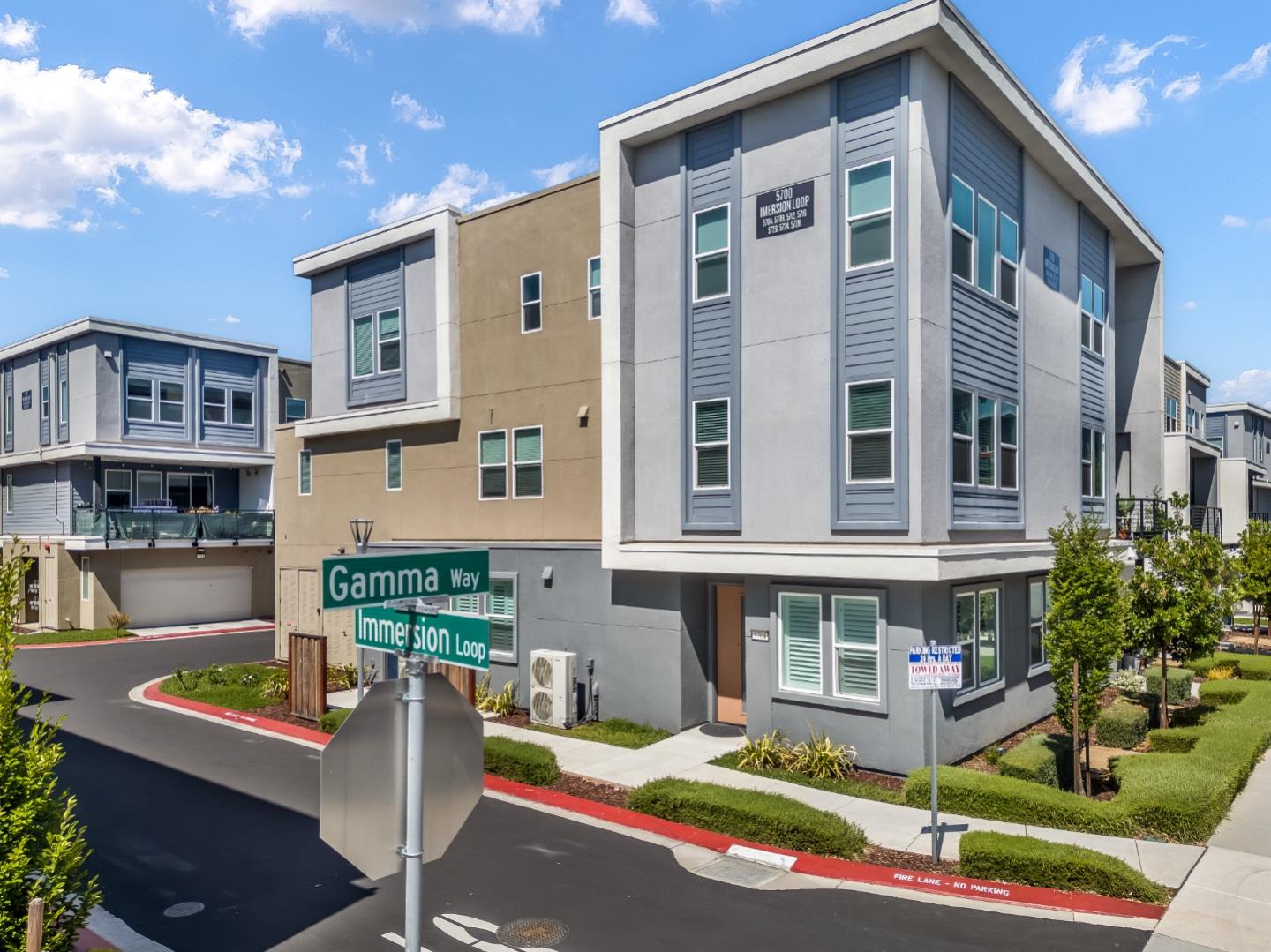 a front view of a building with sitting area
