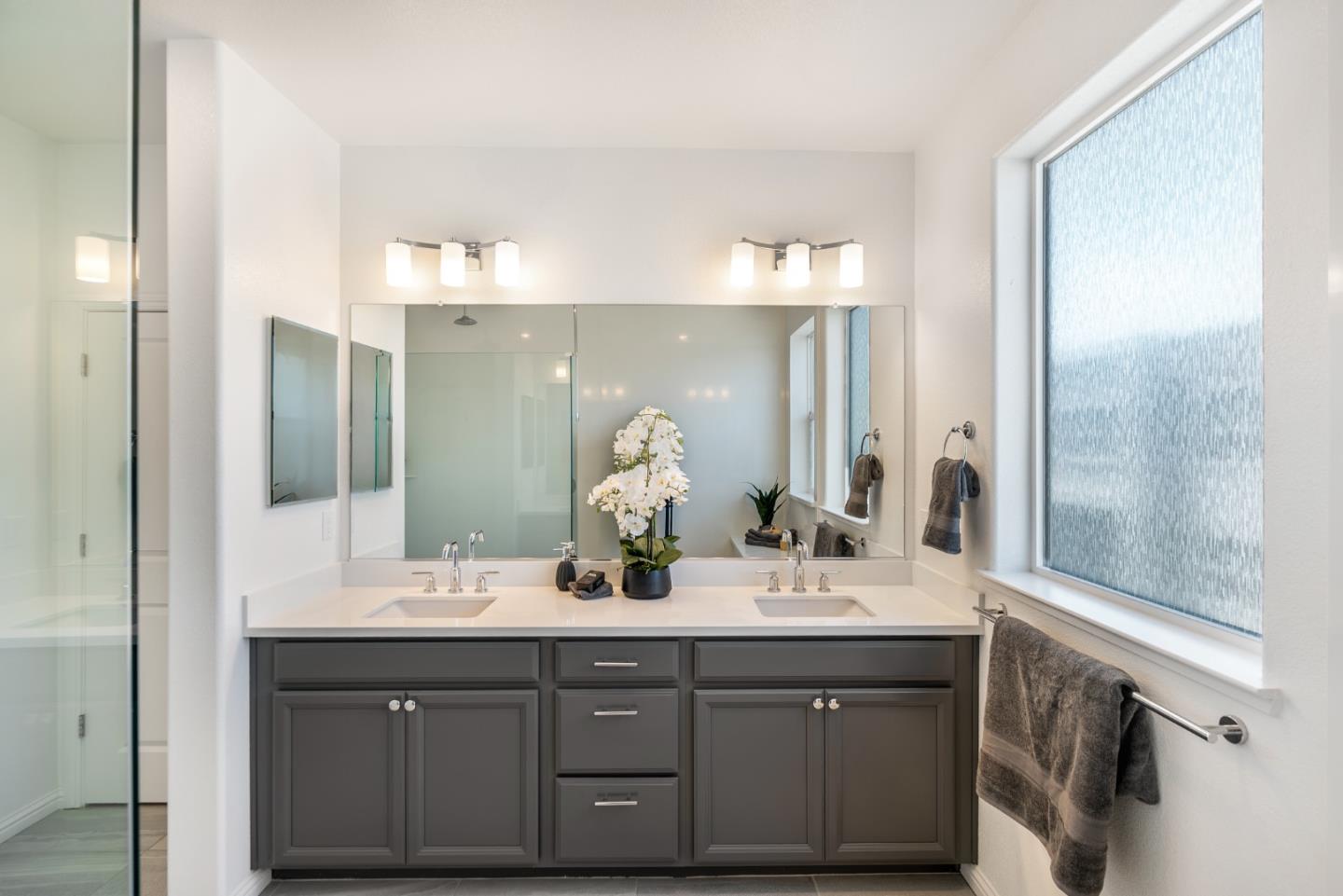 5724 Immersion Loop San Jose, CA 95119 - Photo 13 of 24 a bathroom with a double vanity sink and a mirror