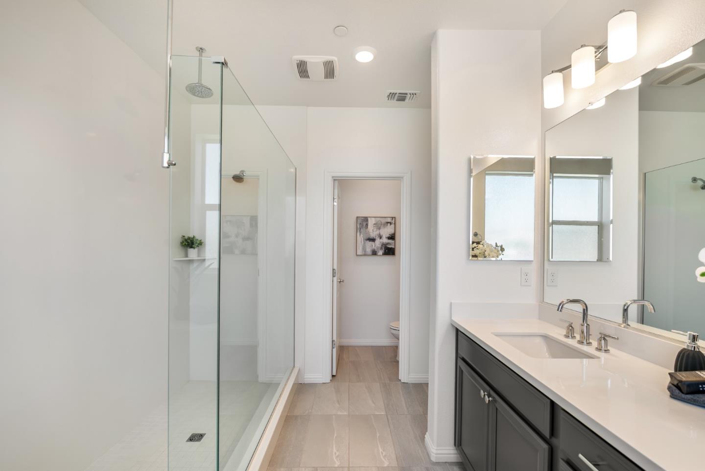 5724 Immersion Loop San Jose, CA 95119 - Photo 14 of 24 a bathroom with a granite countertop sink mirror and double