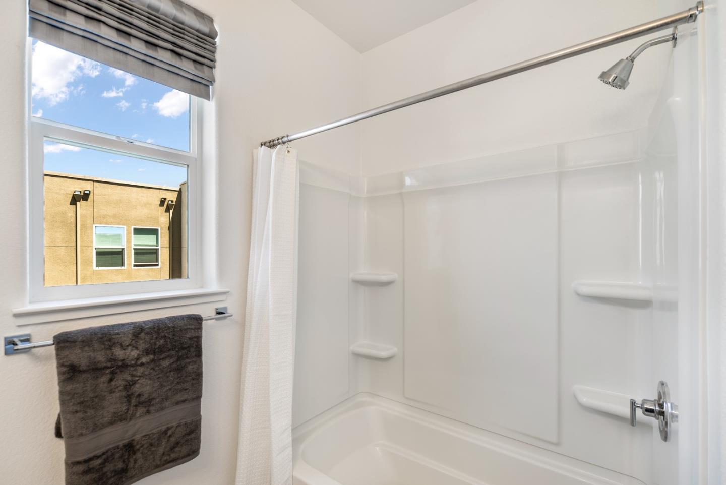 5724 Immersion Loop San Jose, CA 95119 - Photo 19 of 24 a bathroom with a bathtub and a shower
