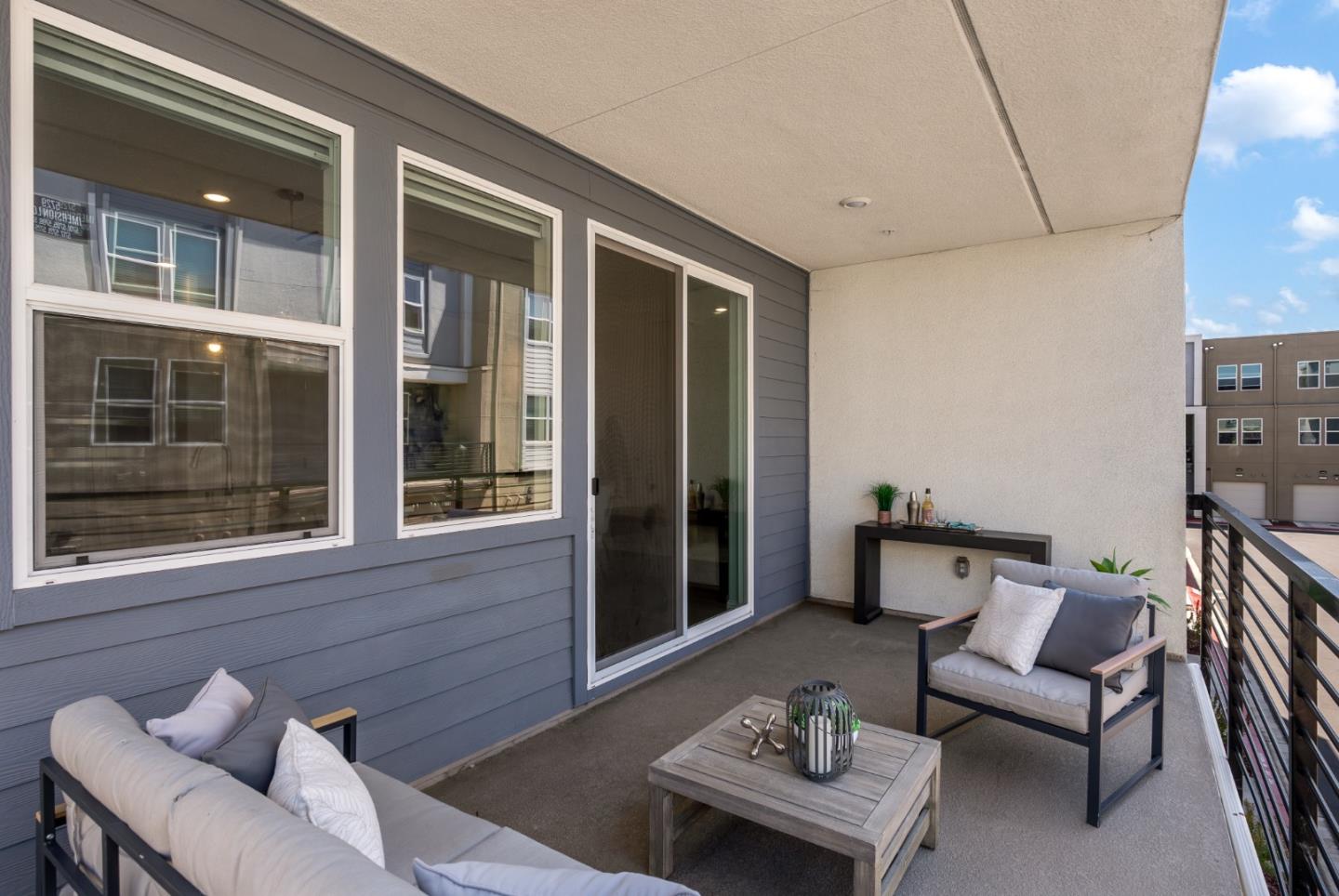 5724 Immersion Loop San Jose, CA 95119 - Photo 21 of 24 a balcony with furniture and a potted plant