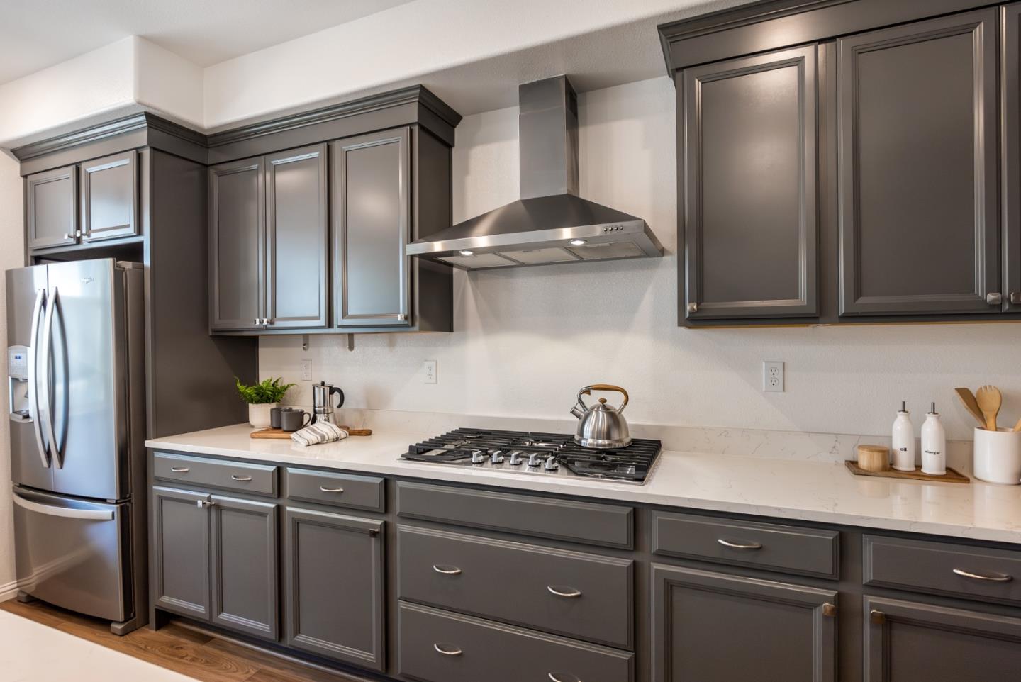5724 Immersion Loop San Jose, CA 95119 - Photo 5 of 24 a kitchen with stainless steel appliances granite countertop a sink stove and refrigerator