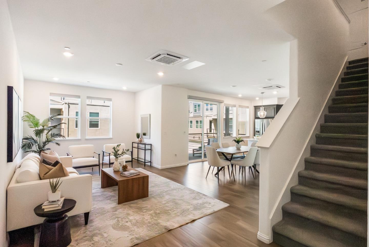 5724 Immersion Loop San Jose, CA 95119 - Photo 9 of 24 a living room with furniture and wooden floor