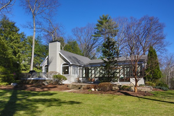 25 Columbine Road Weston, MA 02493 - Photo 2 of 11 a front view of a house with garden