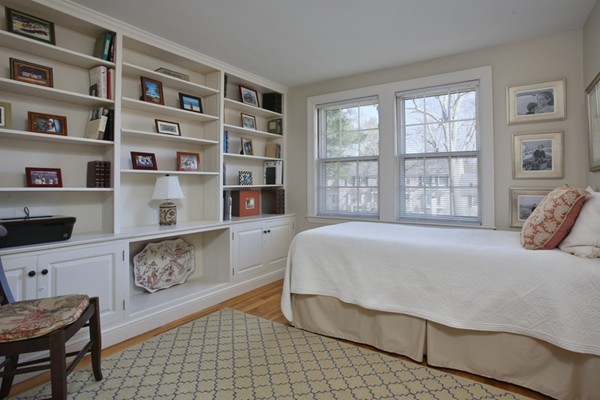 25 Columbine Road Weston, MA 02493 - Photo 10 of 11 a bedroom with a bed a bookshelf and a window