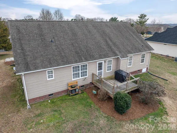 a view of a street with wooden fence